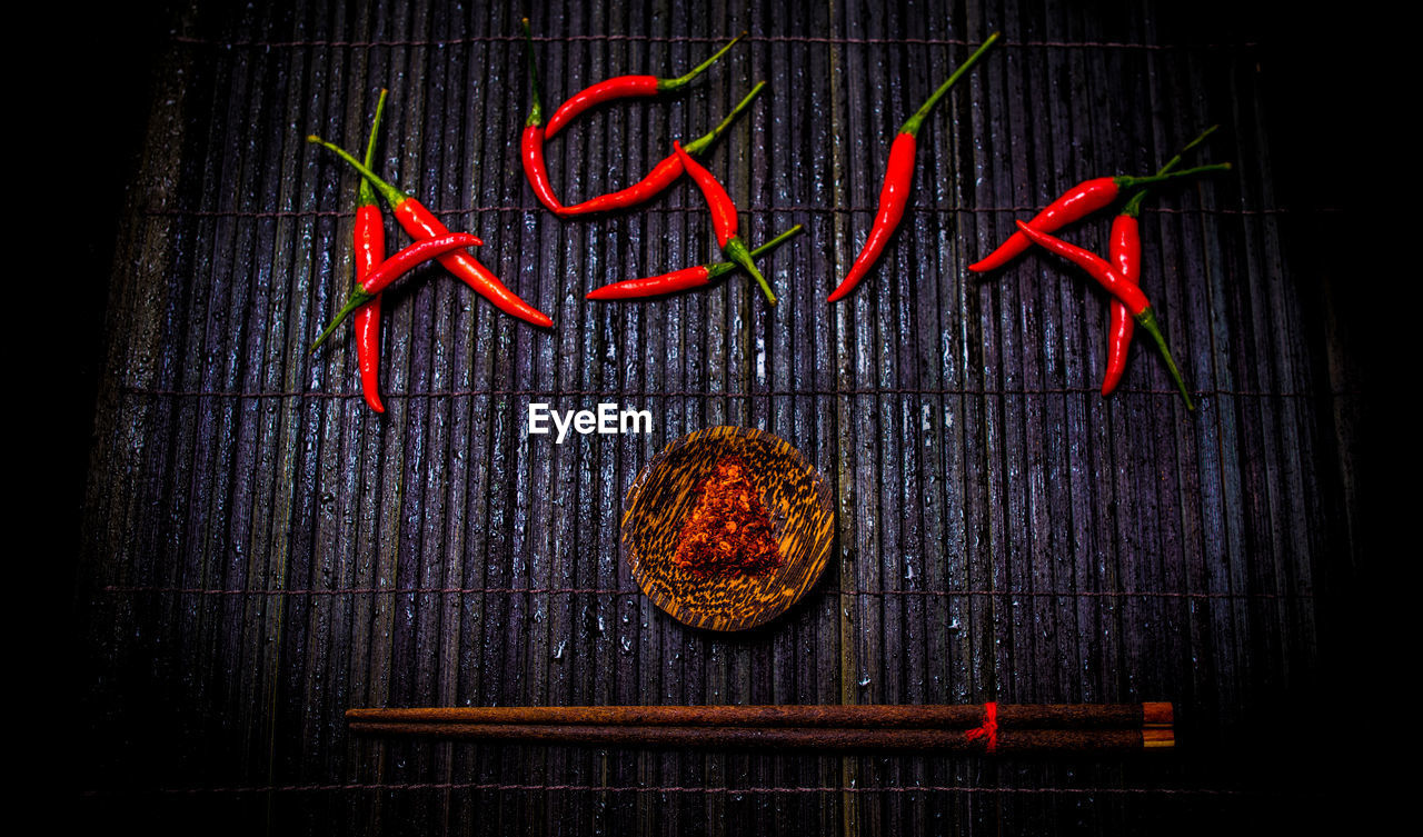 CLOSE-UP OF RED BERRIES ON TABLE