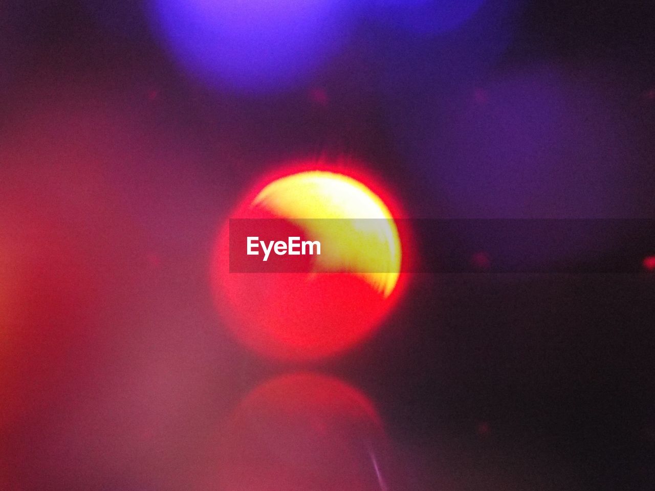 CLOSE-UP OF ILLUMINATED RED LIGHT