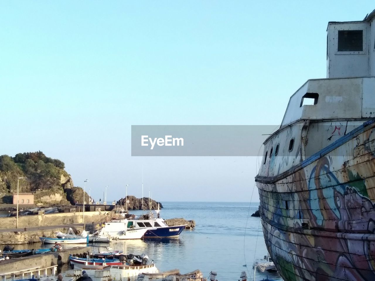 Boats moored at harbor