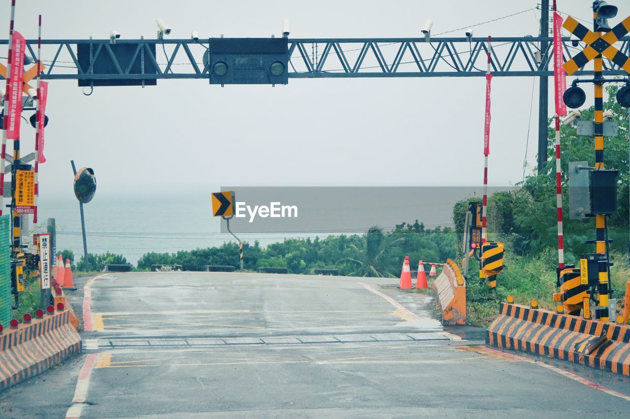 View of road leading towards sea against sky