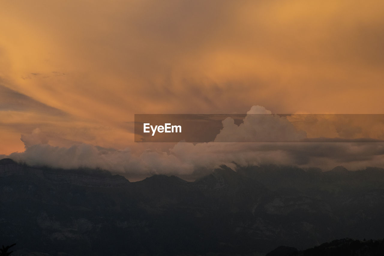 Clouds over mountain range