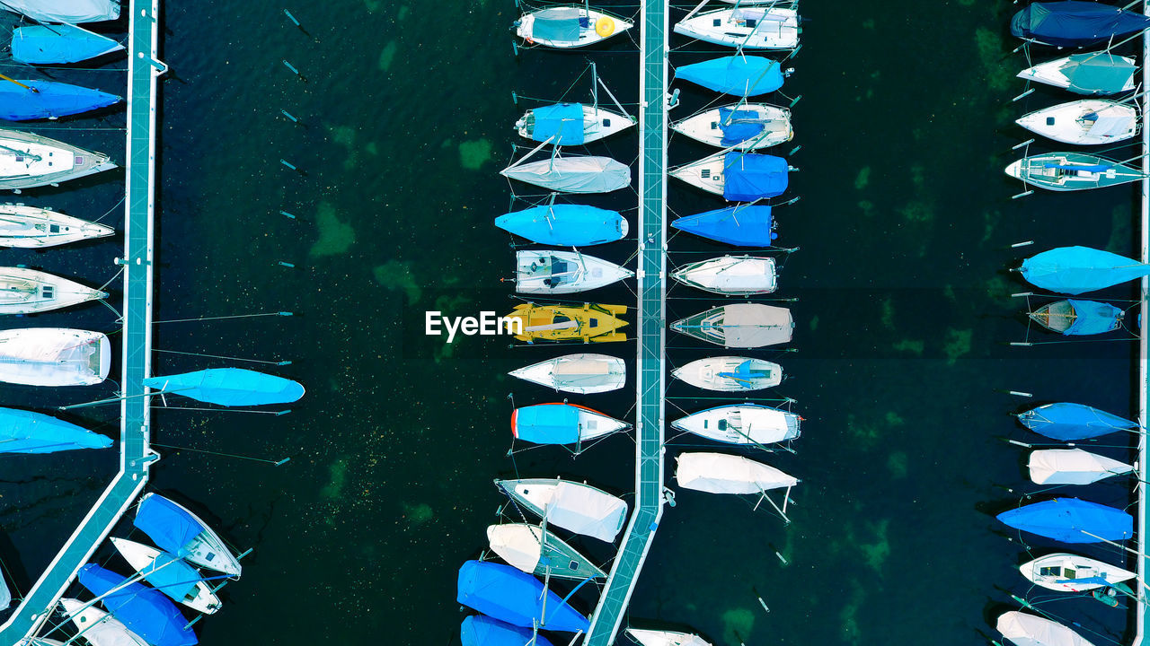 High angle view of boats moored at harbor