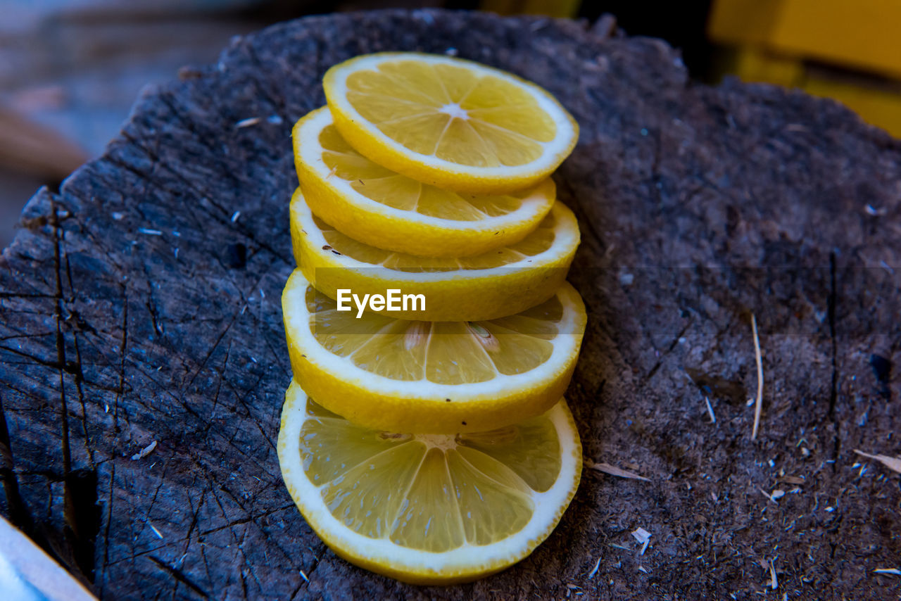 CLOSE-UP OF YELLOW FRUIT ON PLANT