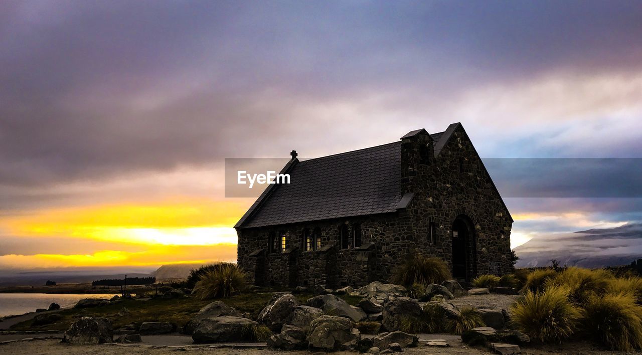 BUILT STRUCTURES AGAINST DRAMATIC SKY