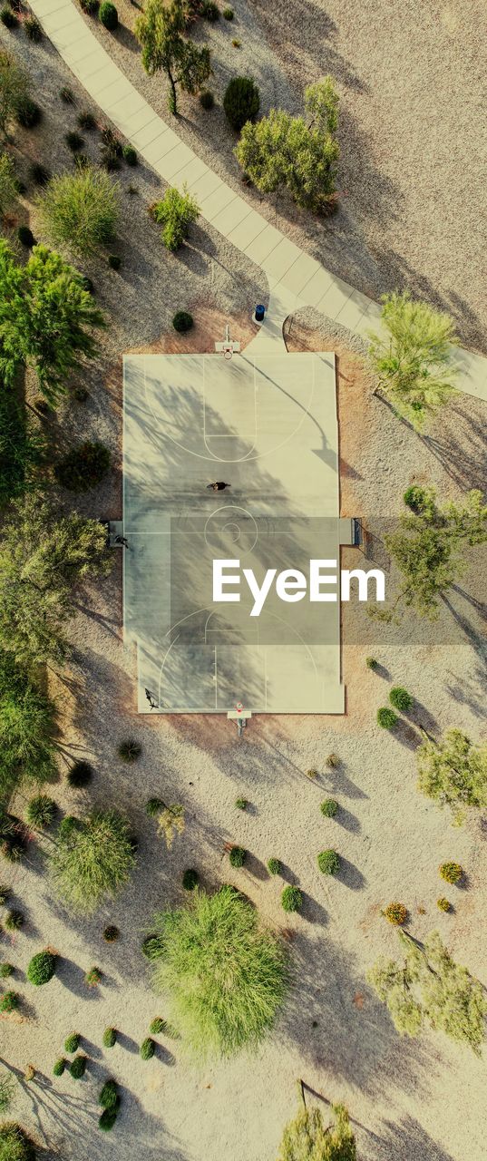 High angle blew of basketball court by trees