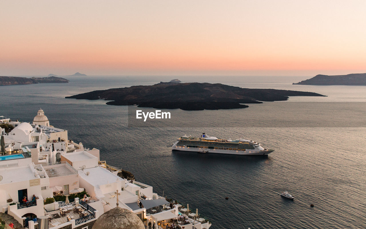 High angle view of cruise ship in sea during sunset