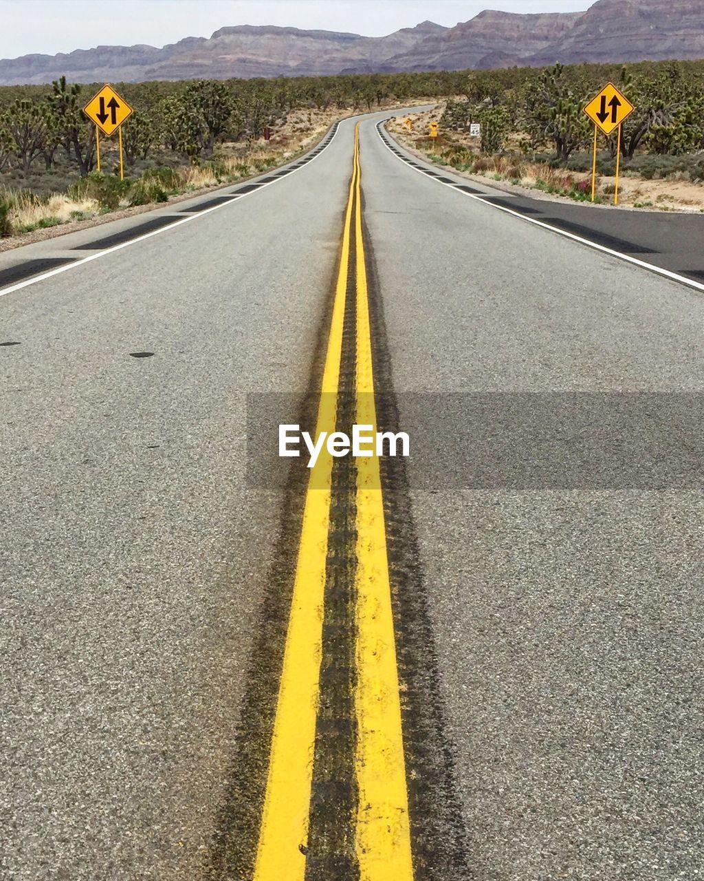 High angle view of empty road with double yellow line