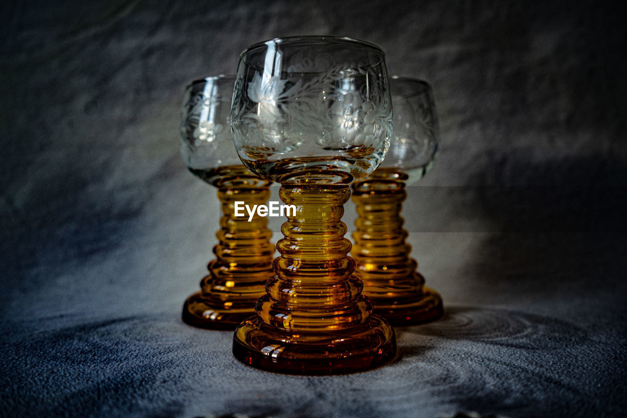 CLOSE-UP OF COIN IN GLASS