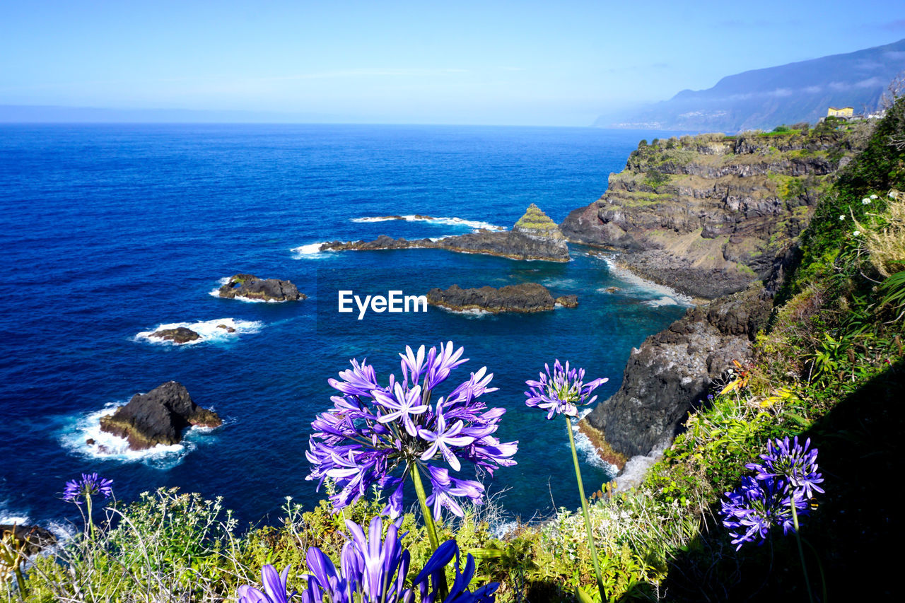 Scenic view of blue sea against sky