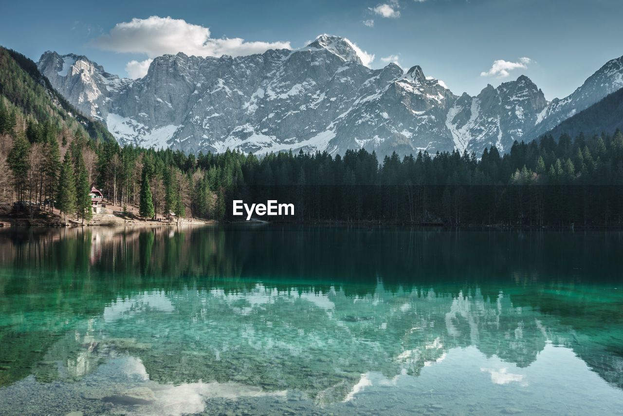 Scenic view of lake and mountains against sky