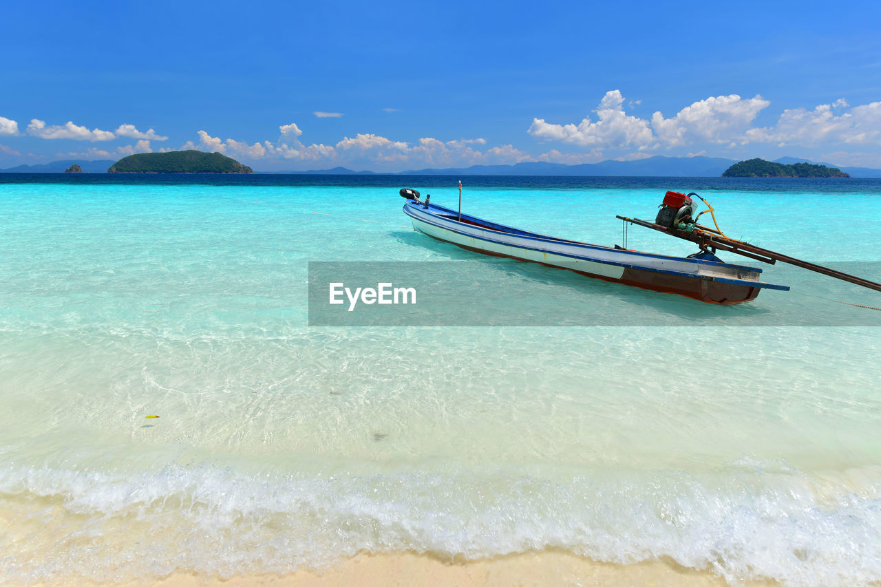 Long tail boat in tropical paradise beach  island on sunny day in myanmar