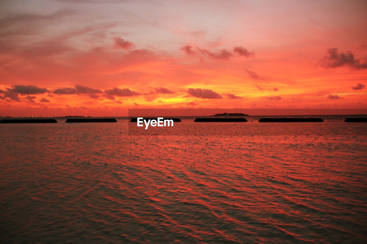 Scenic view of dramatic sky during sunset