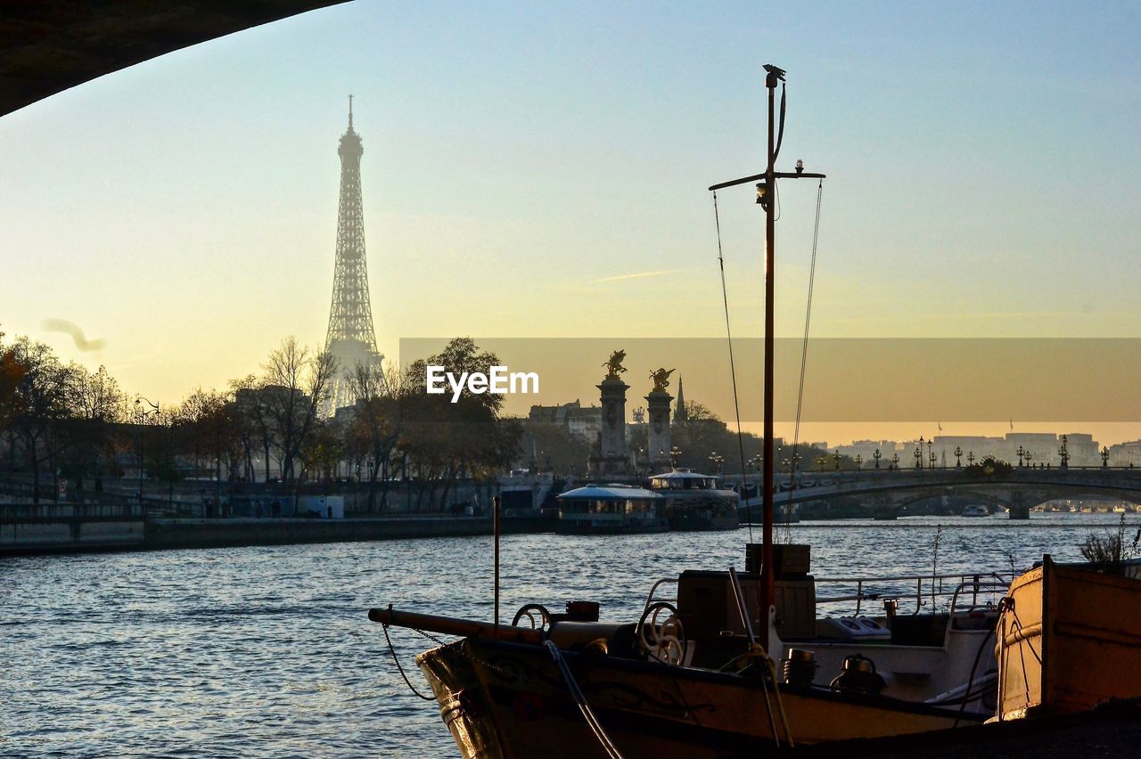 BOATS IN CITY AGAINST CLEAR SKY