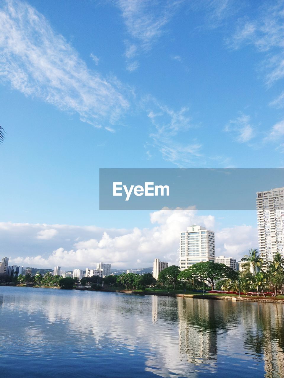 VIEW OF RIVER WITH BUILDINGS IN BACKGROUND