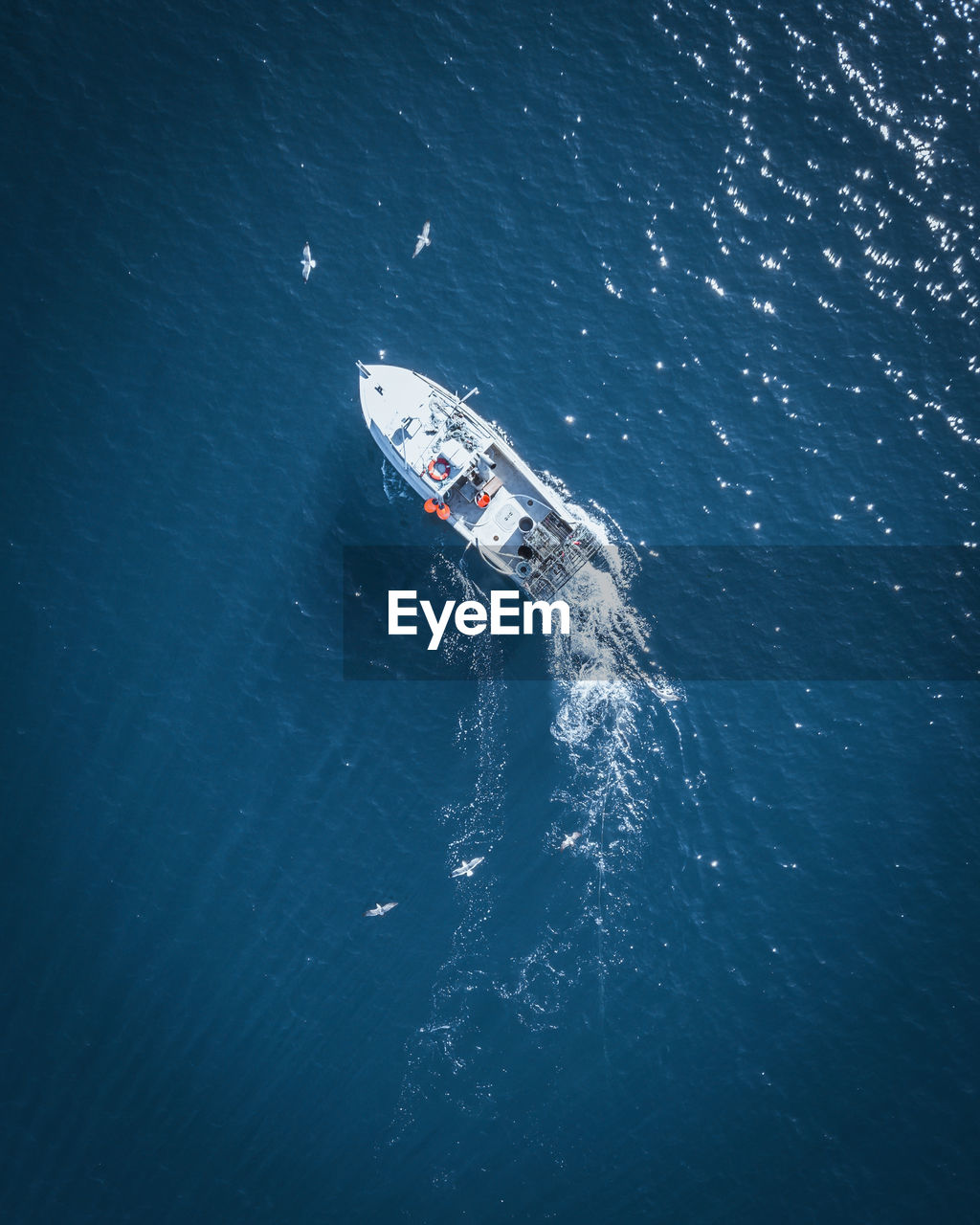 Aerial view of boat sailing in sea