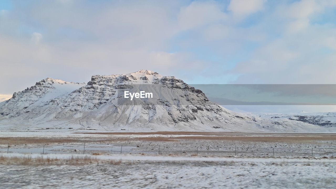 SCENIC VIEW OF SNOW COVERED MOUNTAIN AGAINST SKY