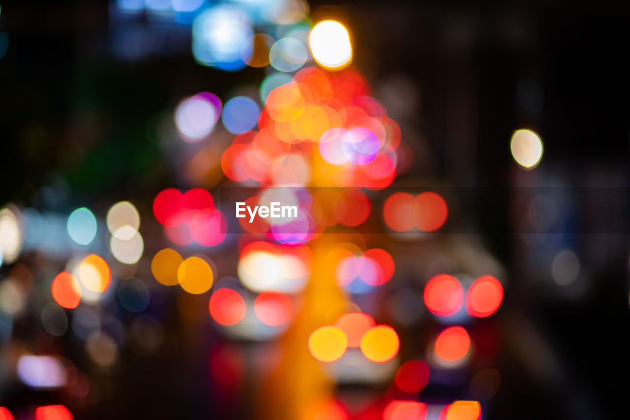 DEFOCUSED IMAGE OF ILLUMINATED CITY