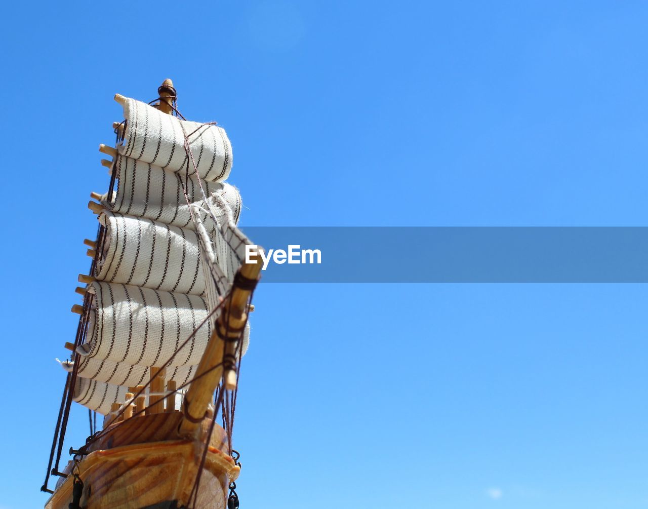 Low angle view of statue against clear blue sky