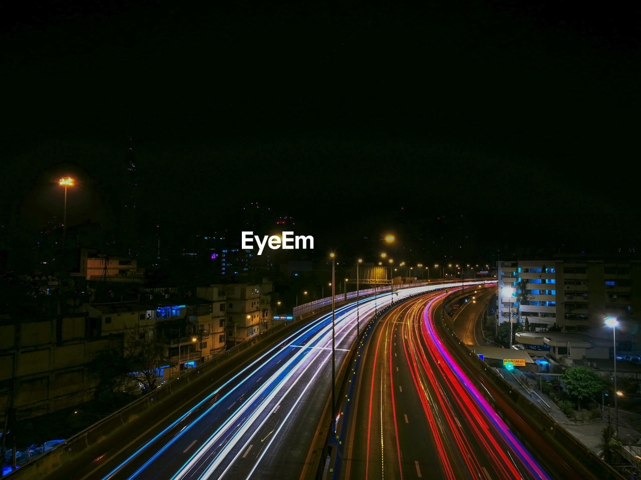 HIGH ANGLE VIEW OF LIGHT TRAILS ON STREET