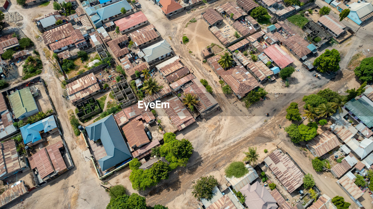 residential area, neighbourhood, suburb, bird's-eye view, aerial photography, architecture, high angle view, city, building exterior, built structure, building, town, aerial view, residential district, urban area, estate, roof, urban design, house, street, no people, day, cityscape, outdoors, community, nature, plant, downtown, transportation, apartment, environment, landscape, full frame, road, tree