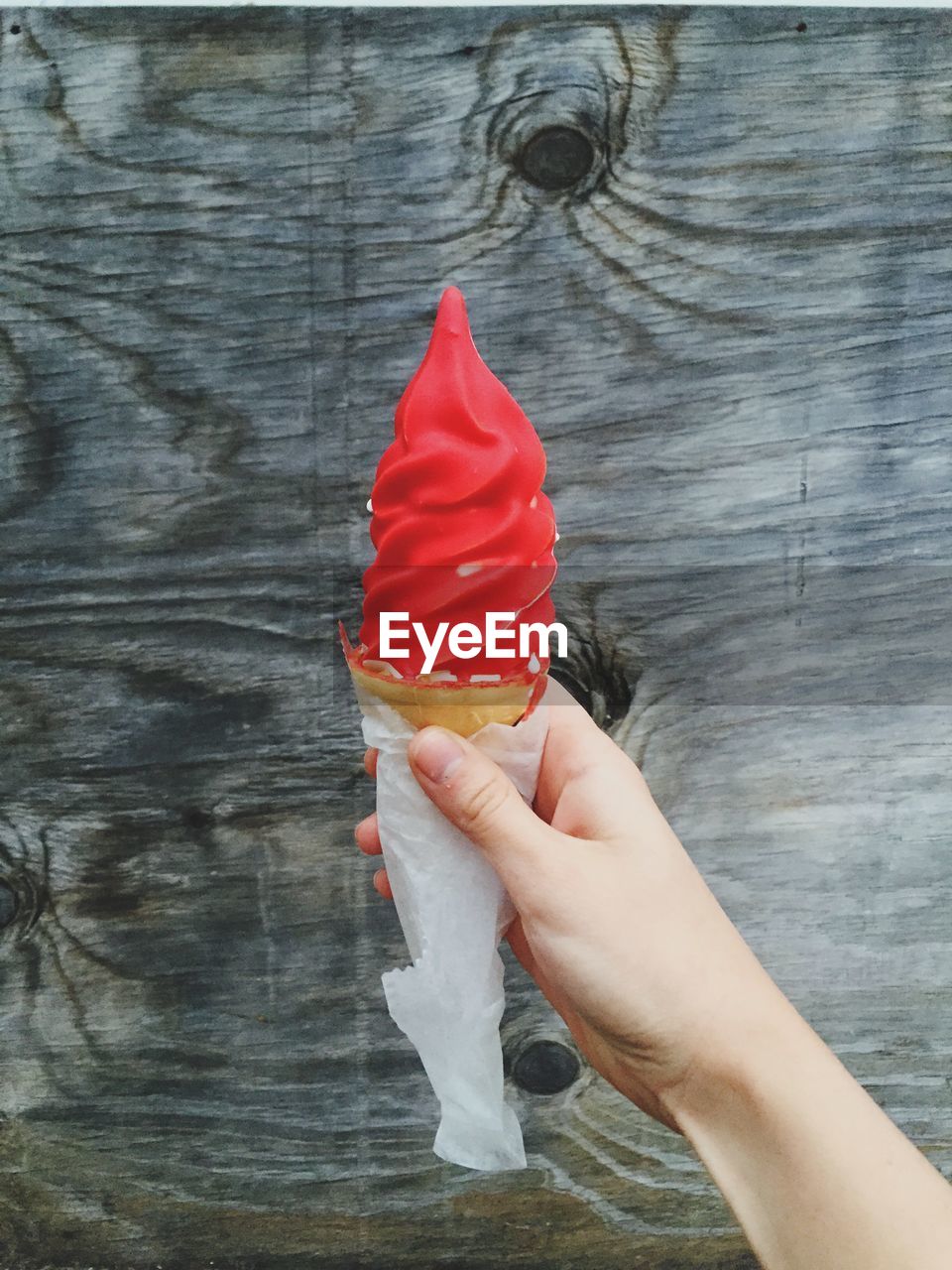 Woman hand holding ice cream cone