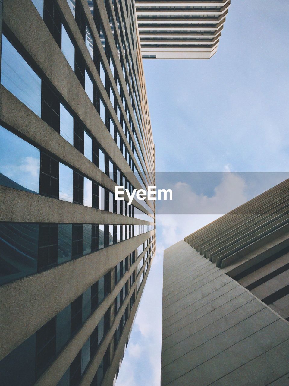 Low angle view of modern buildings against sky