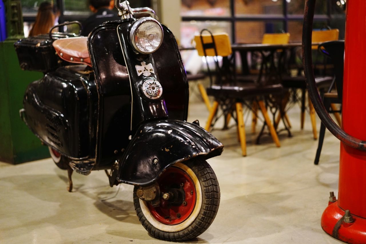 CLOSE-UP OF VINTAGE CAR ON MOTORCYCLE