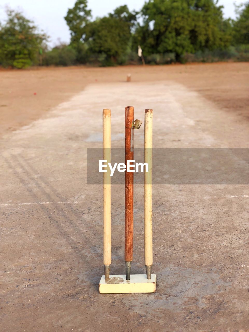 Close-up of cricket stumps on field