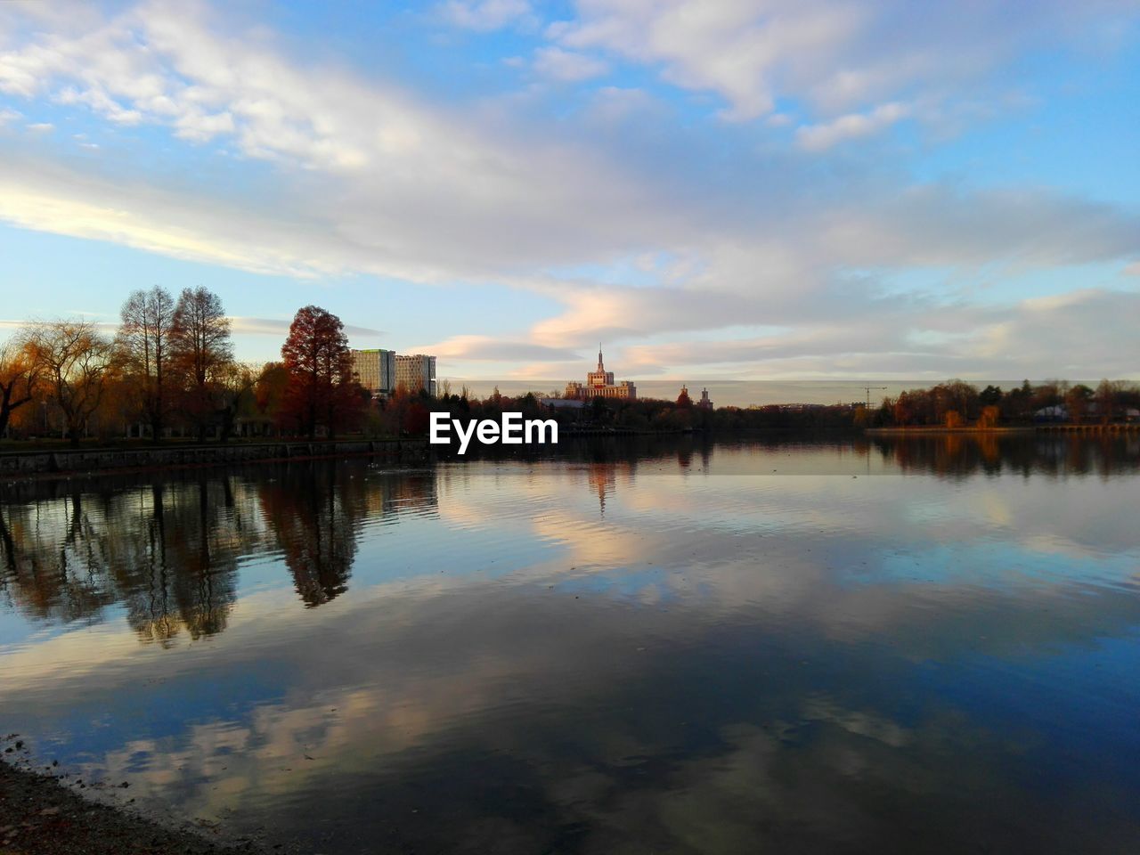 Idyllic view of calm lake against sky during autumn