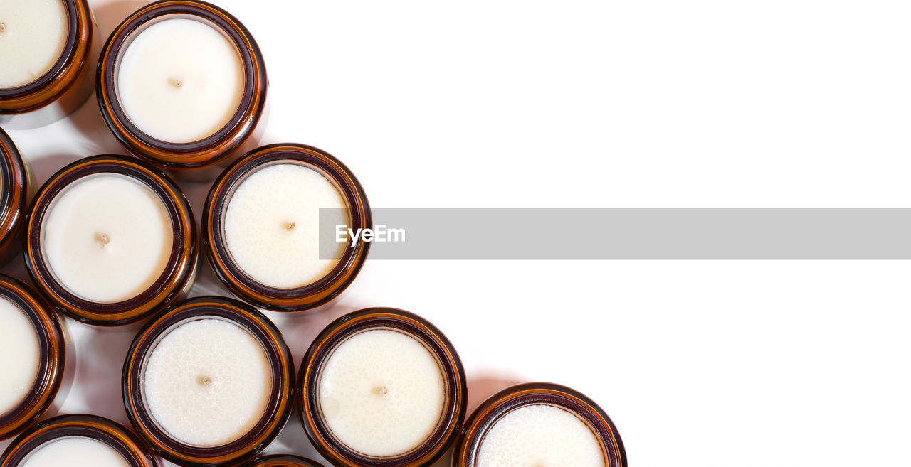 directly above shot of coffee beans on white background