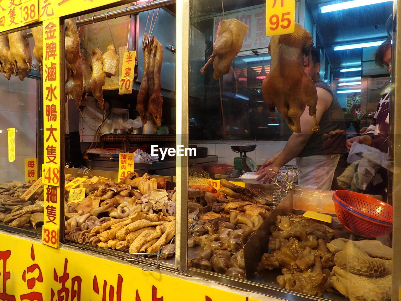 MAN WORKING ON DISPLAY AT MARKET