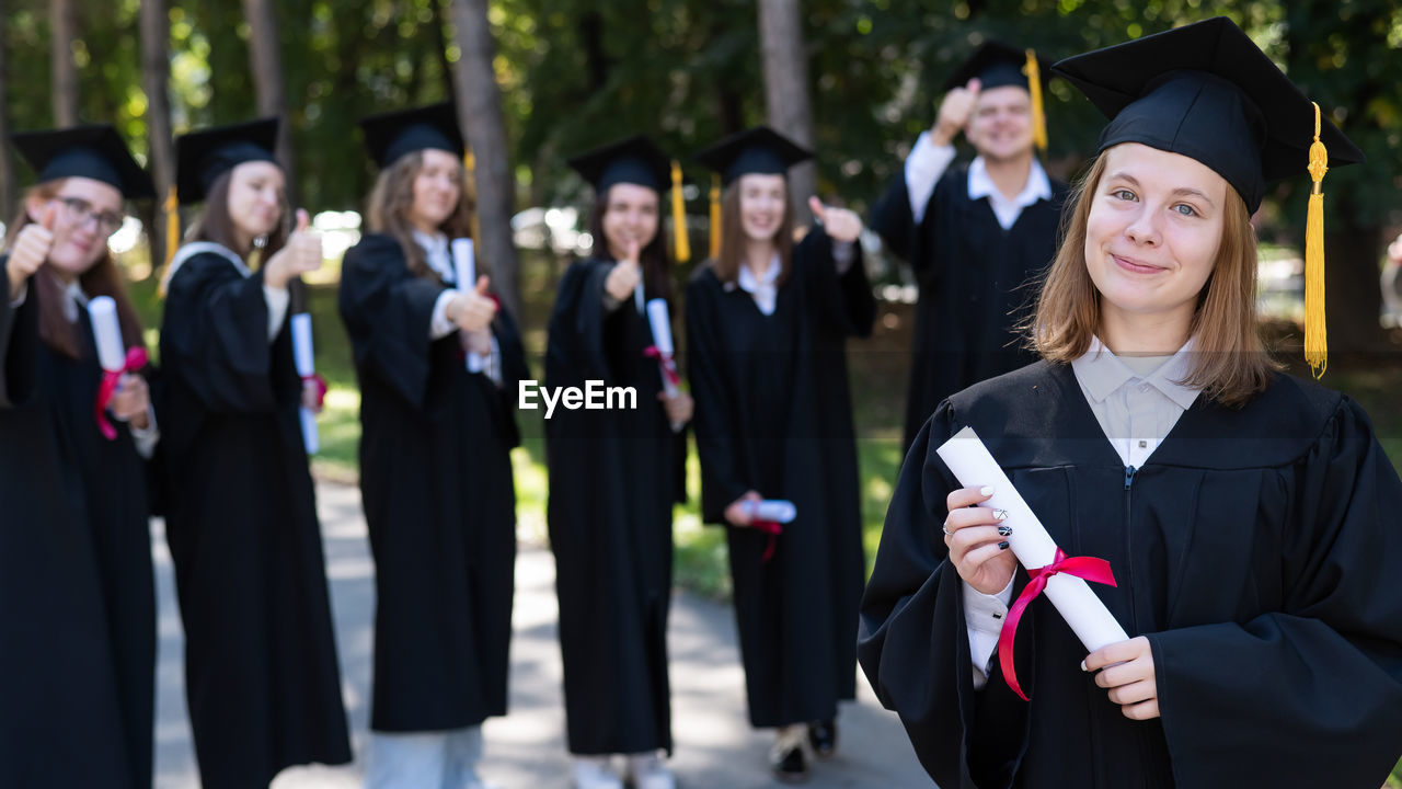 rear view of woman wearing graduation gown