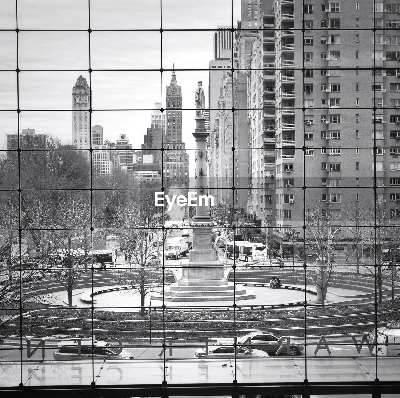 Christopher columbus statue at columbus circle seen through window