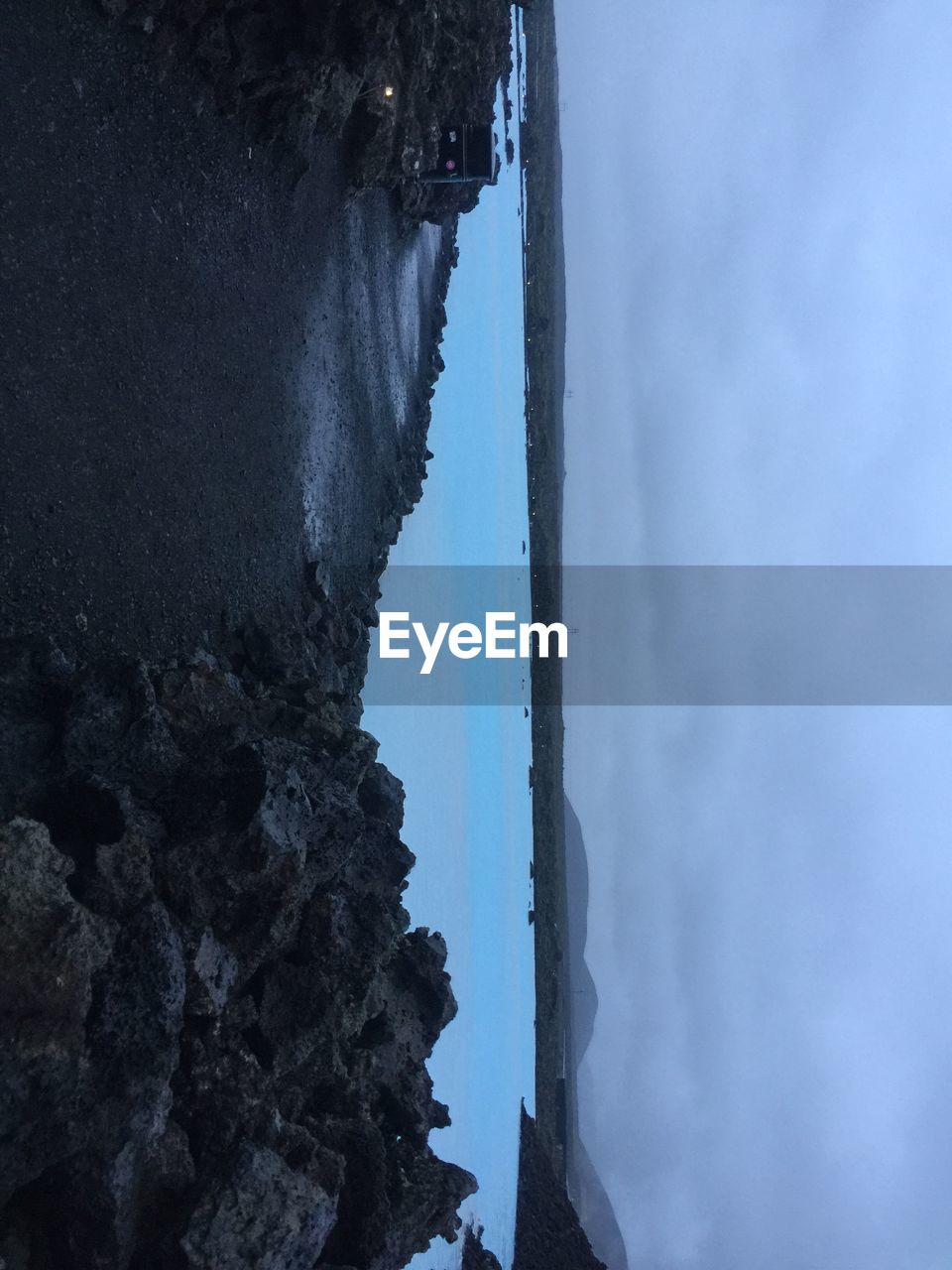 CLOSE-UP REFLECTION OF CLOUDS IN WATER