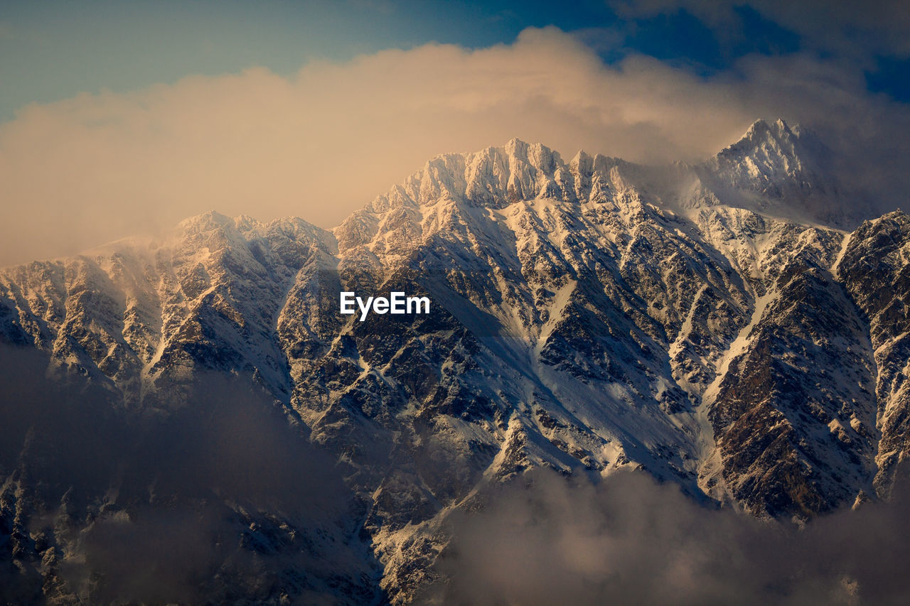 Snow and clouds view of the remarkables mountain in queenstown new zealand