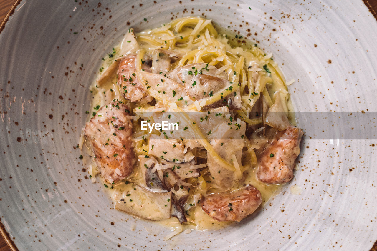 food, food and drink, dish, freshness, healthy eating, produce, wellbeing, cuisine, italian food, directly above, spaghetti, carbonara, pasta, plate, no people, high angle view, vegetable, serving size, indoors, meal, herb, close-up, still life, meat
