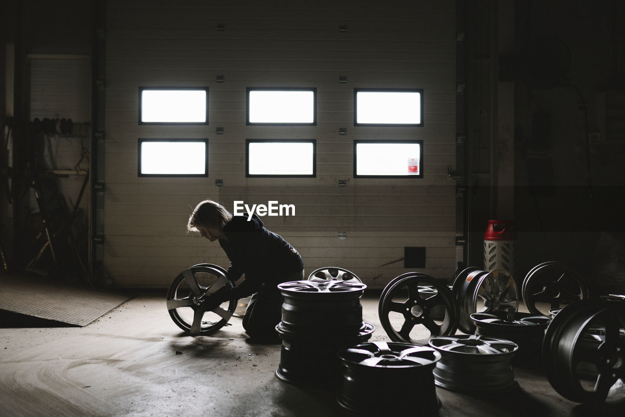 Female mechanic in car garage