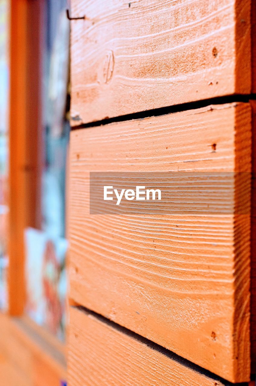 Close-up of orange wooden door