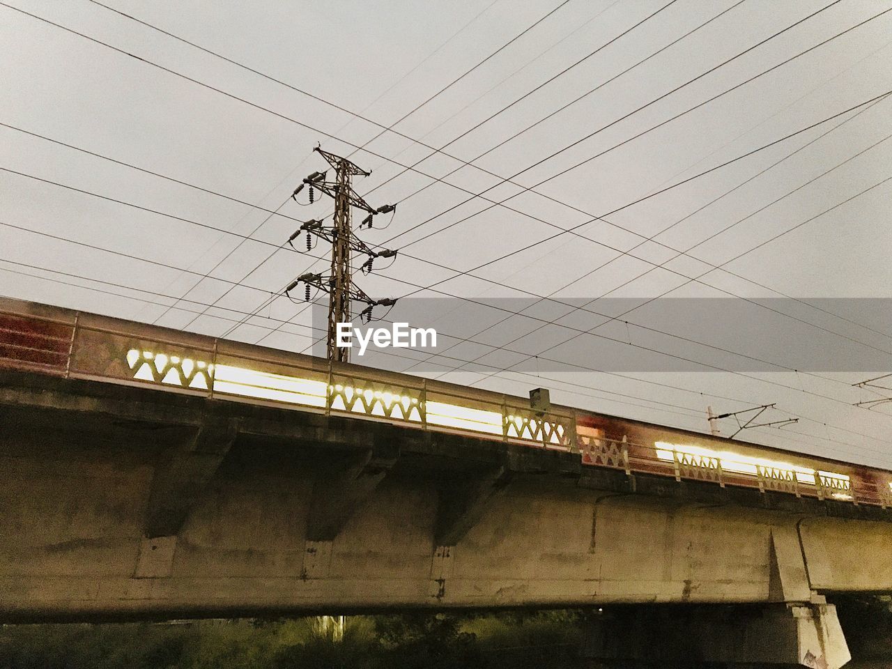 LOW ANGLE VIEW OF POWER LINES AGAINST SKY