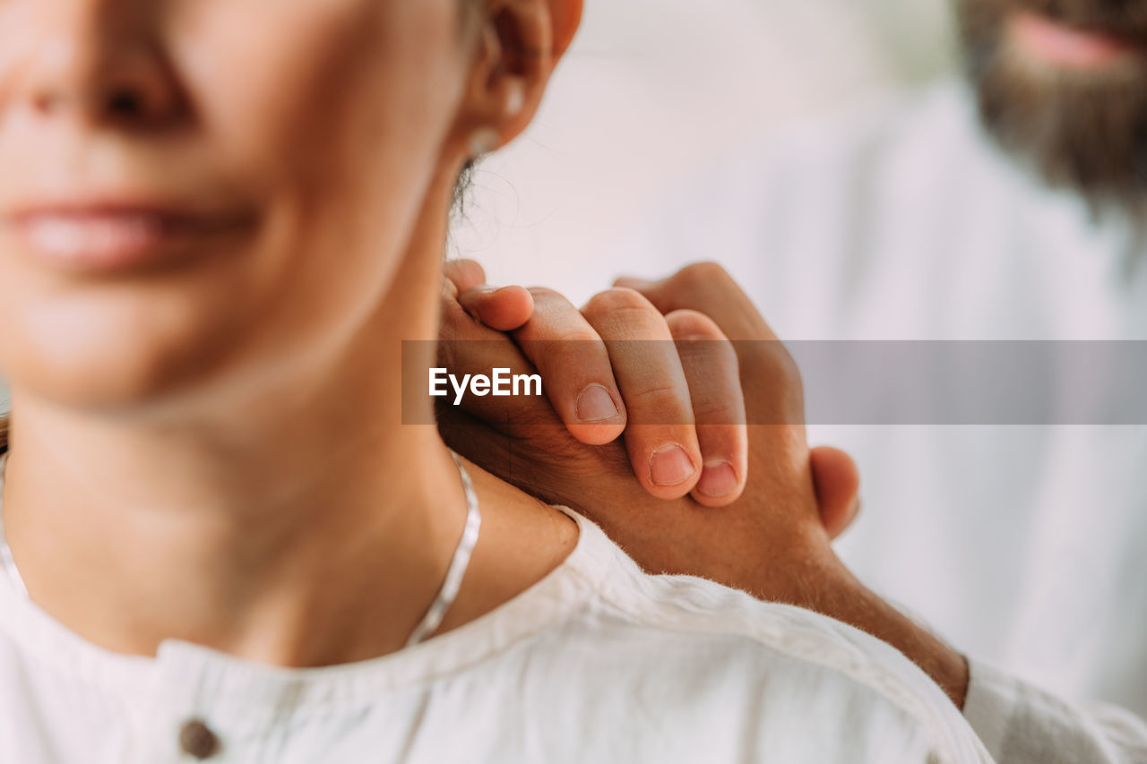 Woman enjoying shiatsu neck and shoulders massage.