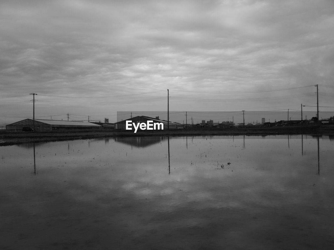 water, sky, reflection, cloud, black and white, nature, monochrome, architecture, monochrome photography, no people, built structure, tranquility, environment, beauty in nature, transportation, outdoors, sea, scenics - nature, tranquil scene, industry, horizon, nautical vessel, day, landscape