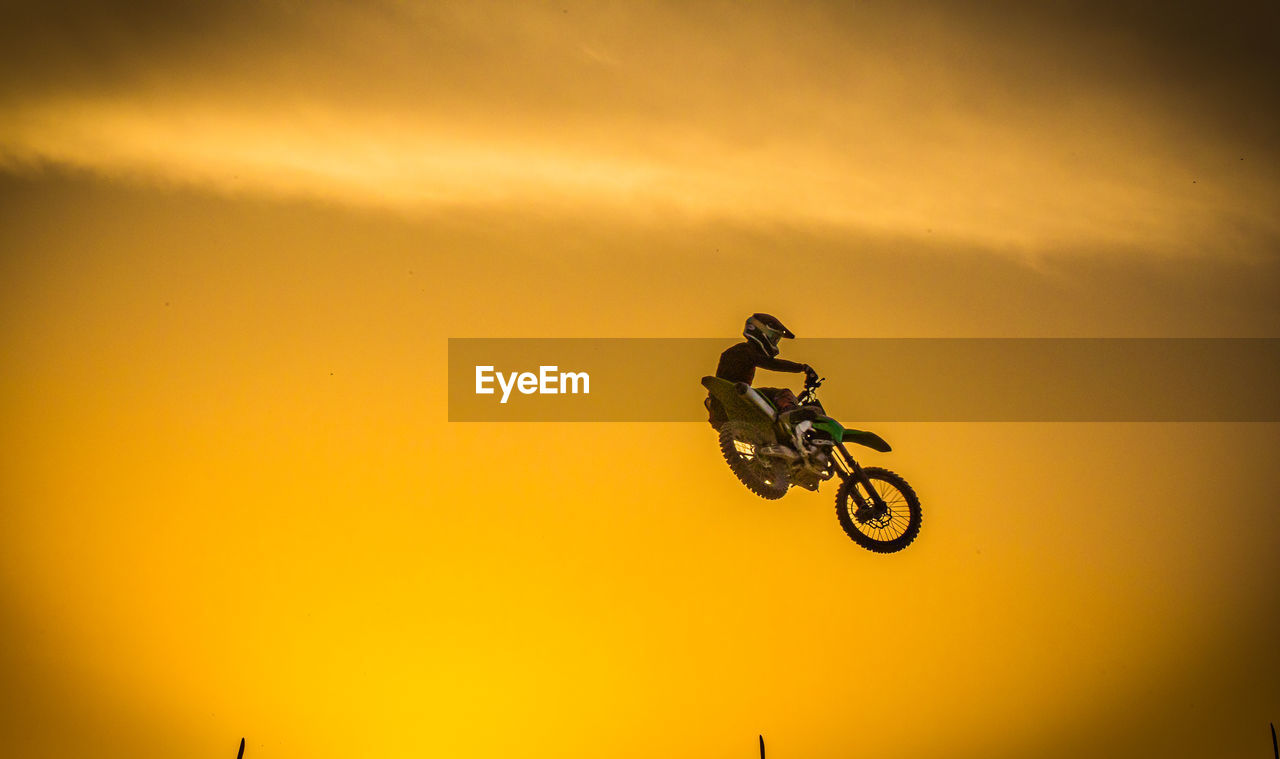 Motocross rider flying during practice session in kuwait. 
