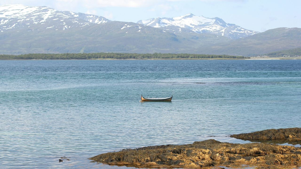 Scenic view of river against mountains