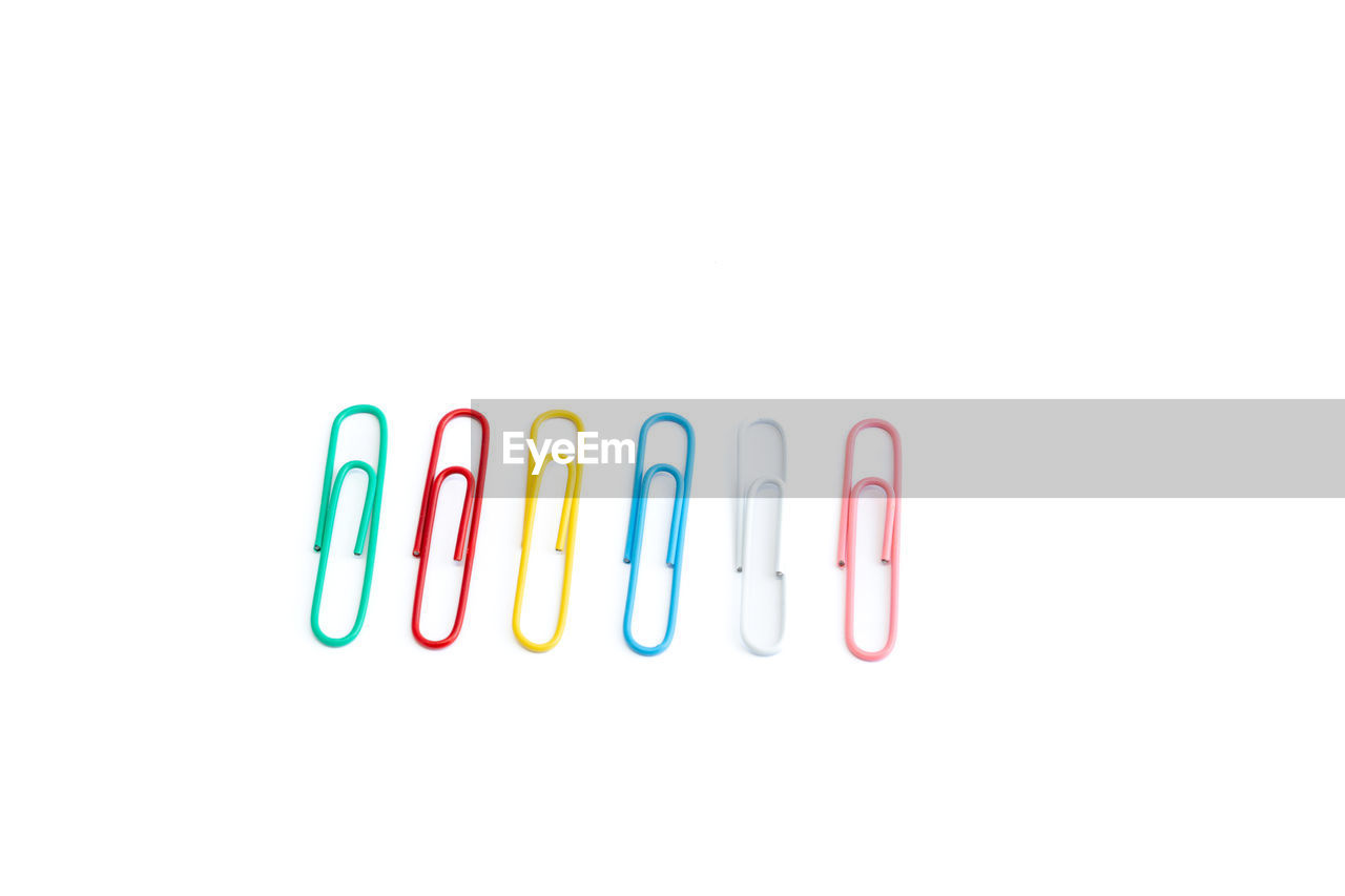 clip, white background, paper clip, studio shot, indoors, no people, multi colored, office supply, copy space, cut out, variation, close-up, in a row, office, group of objects