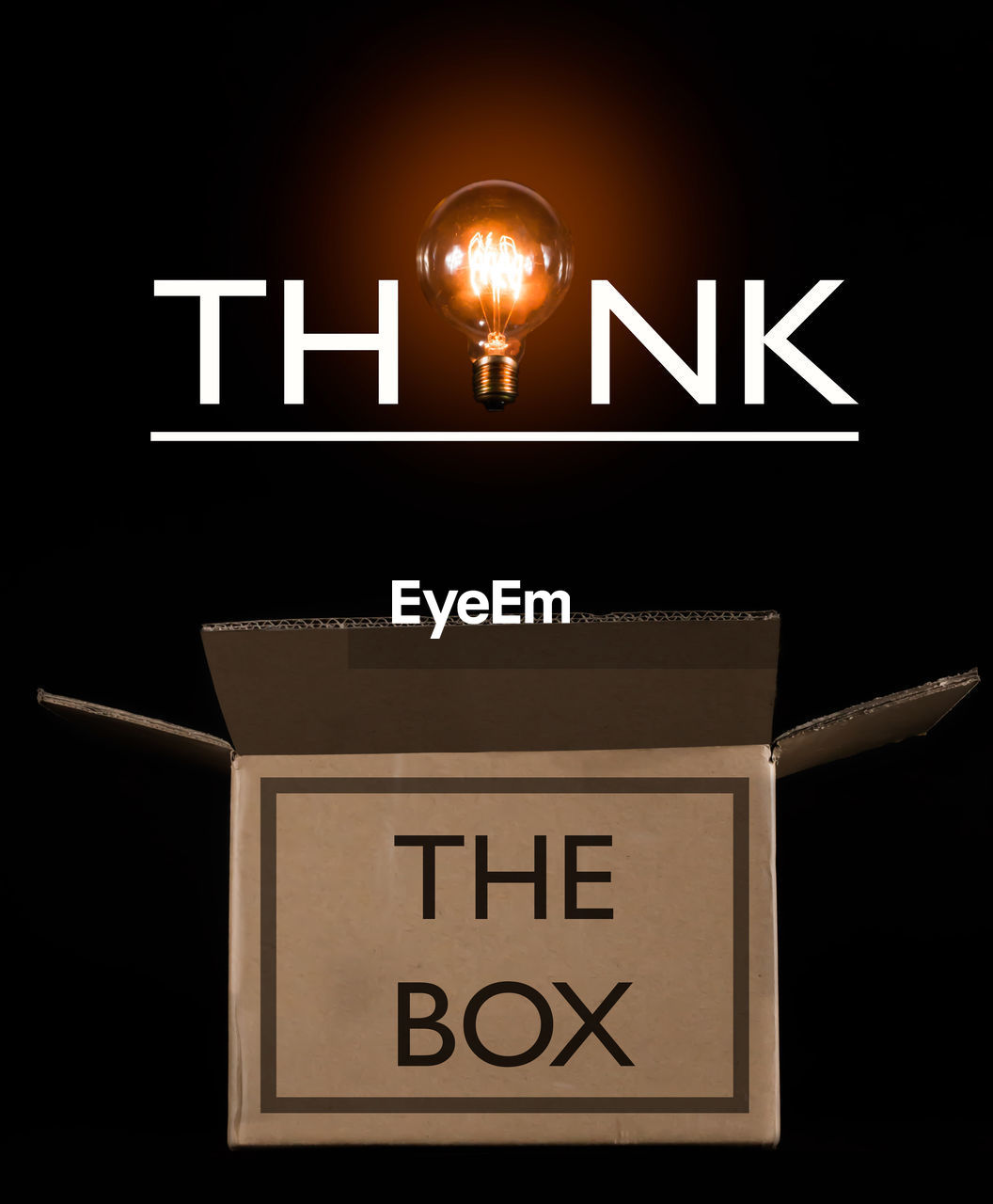 Digital composite image of open box with text against black background