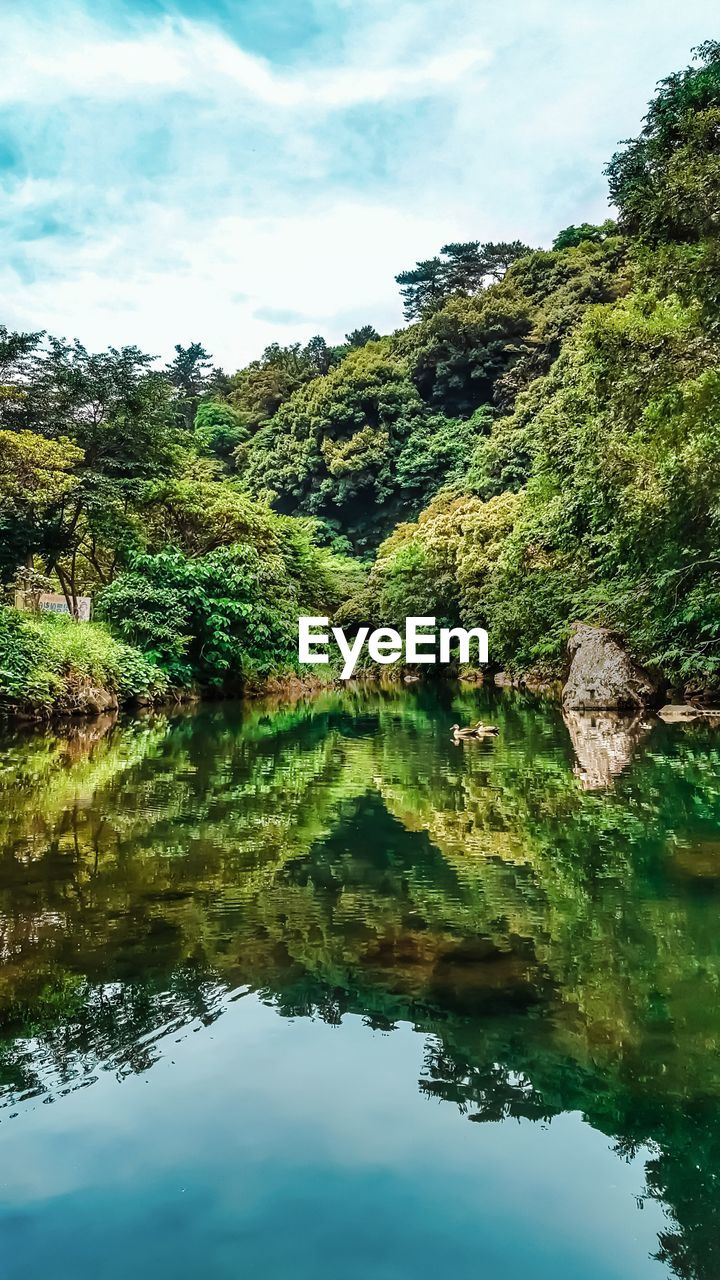 SCENIC VIEW OF LAKE WITH REFLECTION AGAINST SKY