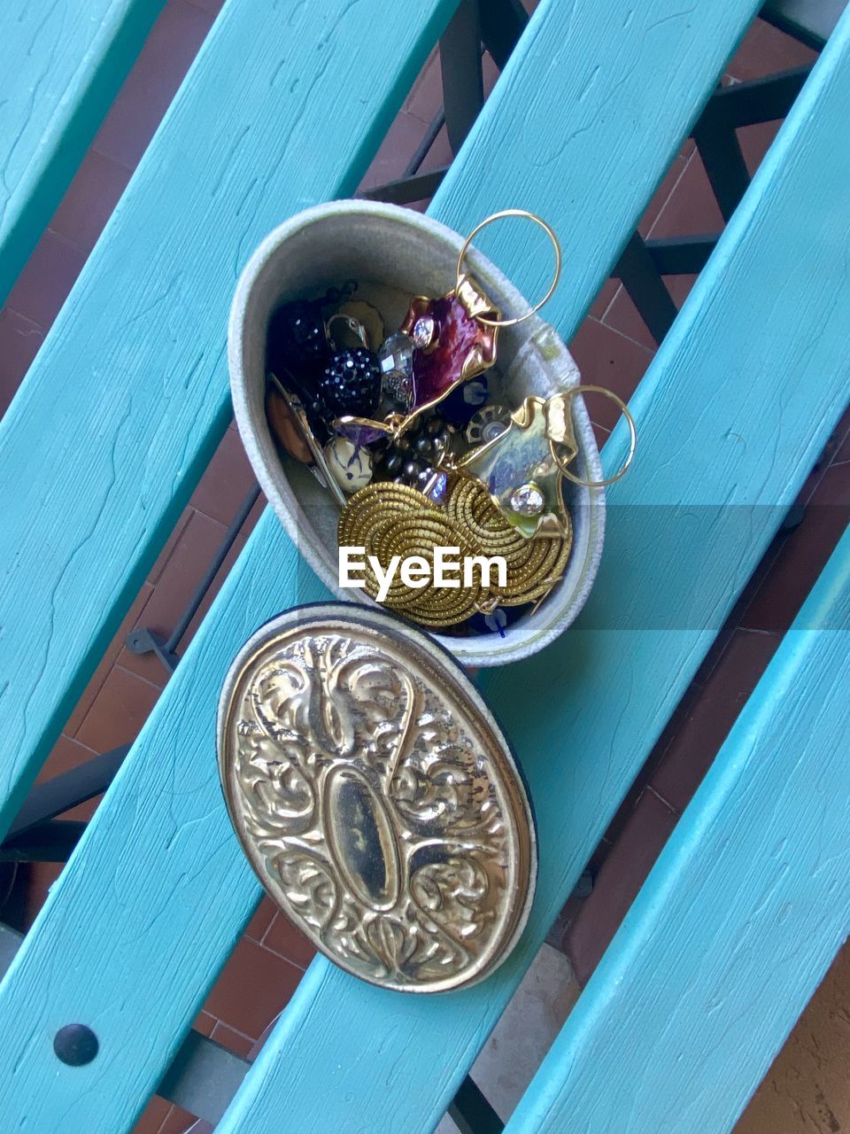 blue, wood, metal, high angle view, no people, coin, fashion accessory, table, gold, jewellery, finance, day