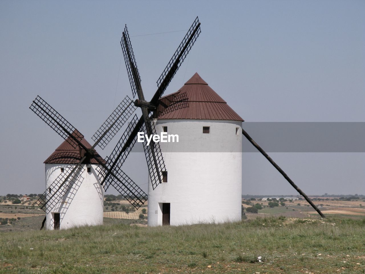 mill, windmill, renewable energy, alternative energy, wind power, building, wind turbine, environmental conservation, turbine, power generation, traditional windmill, environment, architecture, rural scene, sky, wind, built structure, nature, landscape, grass, agriculture, field, wind farm, no people, farm, day, rural area, building exterior, land, clear sky, technology, machine, plant, history, outdoors, the past