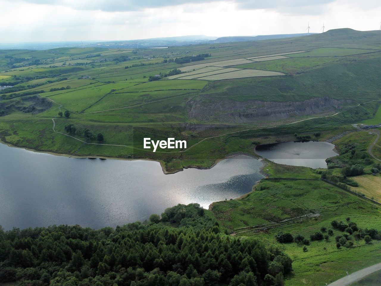 SCENIC VIEW OF GREEN LANDSCAPE AGAINST SKY