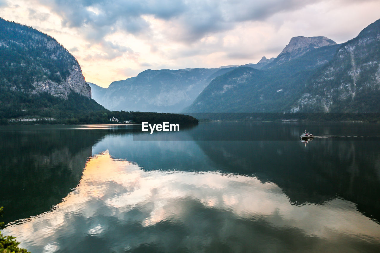 Scenic view of lake against dramatic sky